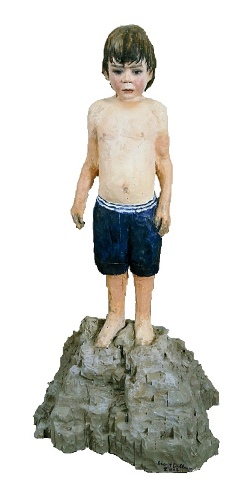 Boy on pile of sand